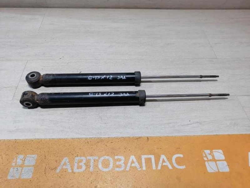 Almera G15 амортизатор задний
