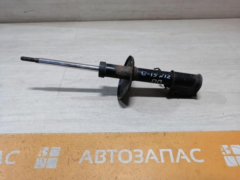 Almera G15 №12 амортизатор передний