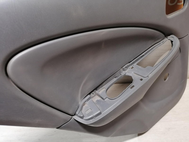 Almera Classic обшивка двери задняя левая деф