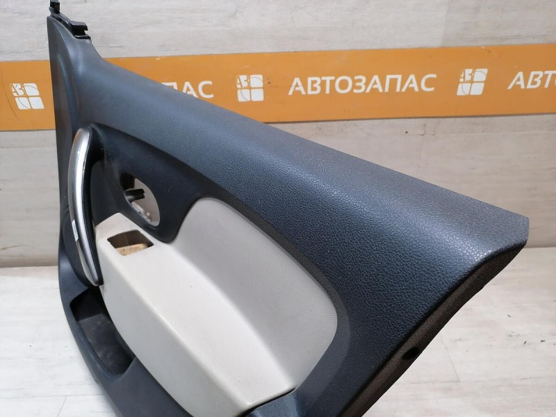 Logan 2 обшивка двери передняя правая эл черная+бежевая деф