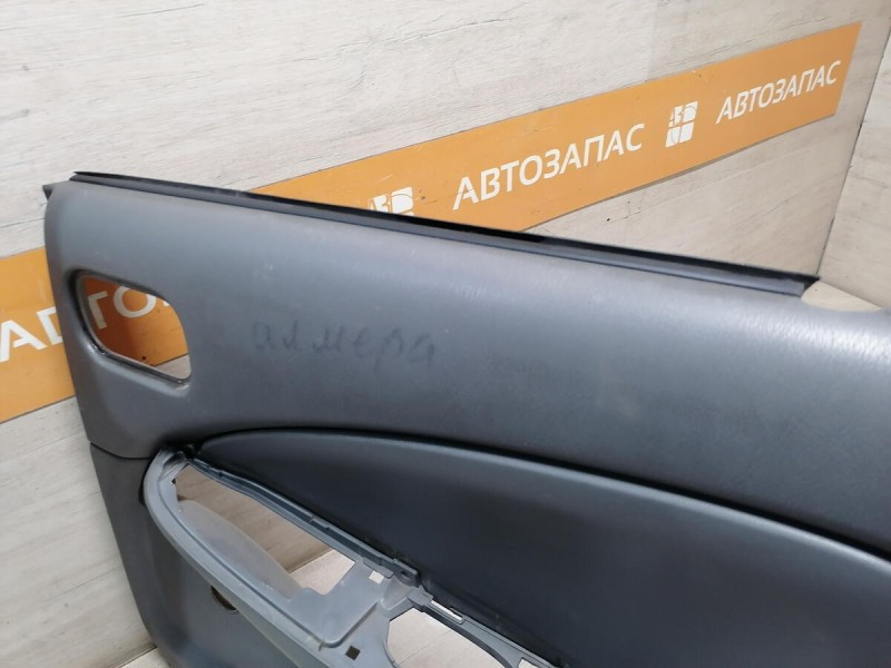 Almera Classic обшивка двери задняя правая мех