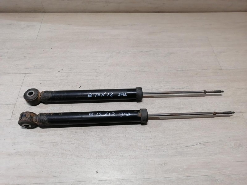 Almera G15 амортизатор задний