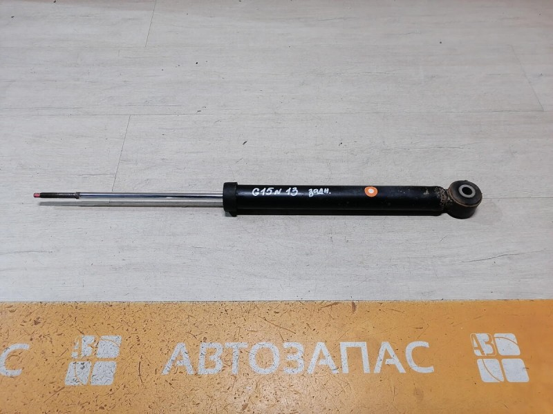 Almera G15 амортизатор задний