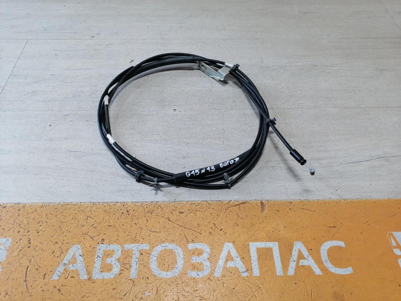 Almera G15 трос багажника