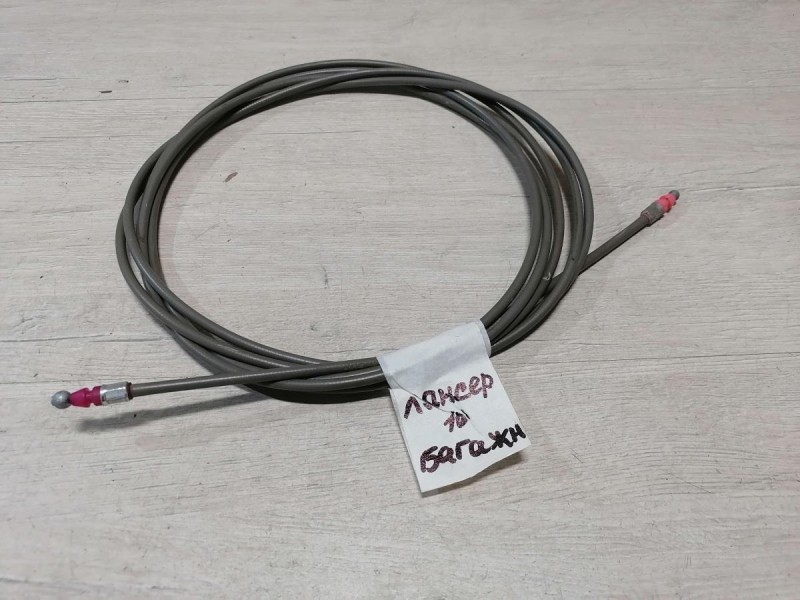 Lancer 10 №1 трос багажника